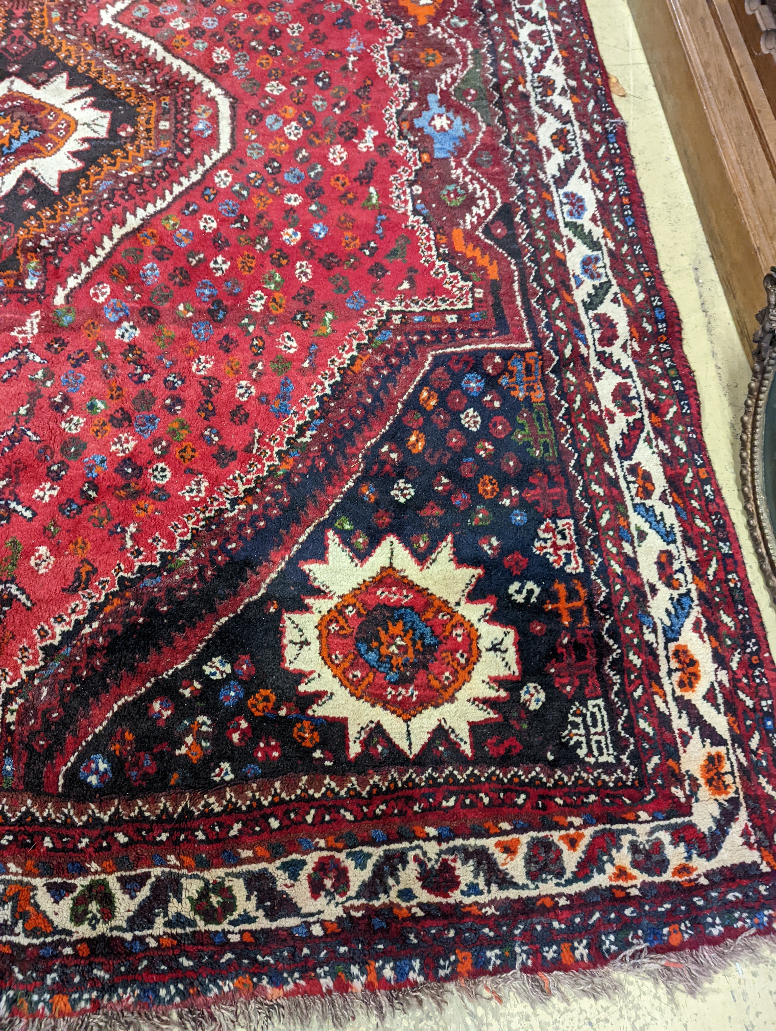 A North West Persian red ground carpet, 335 x 220cm